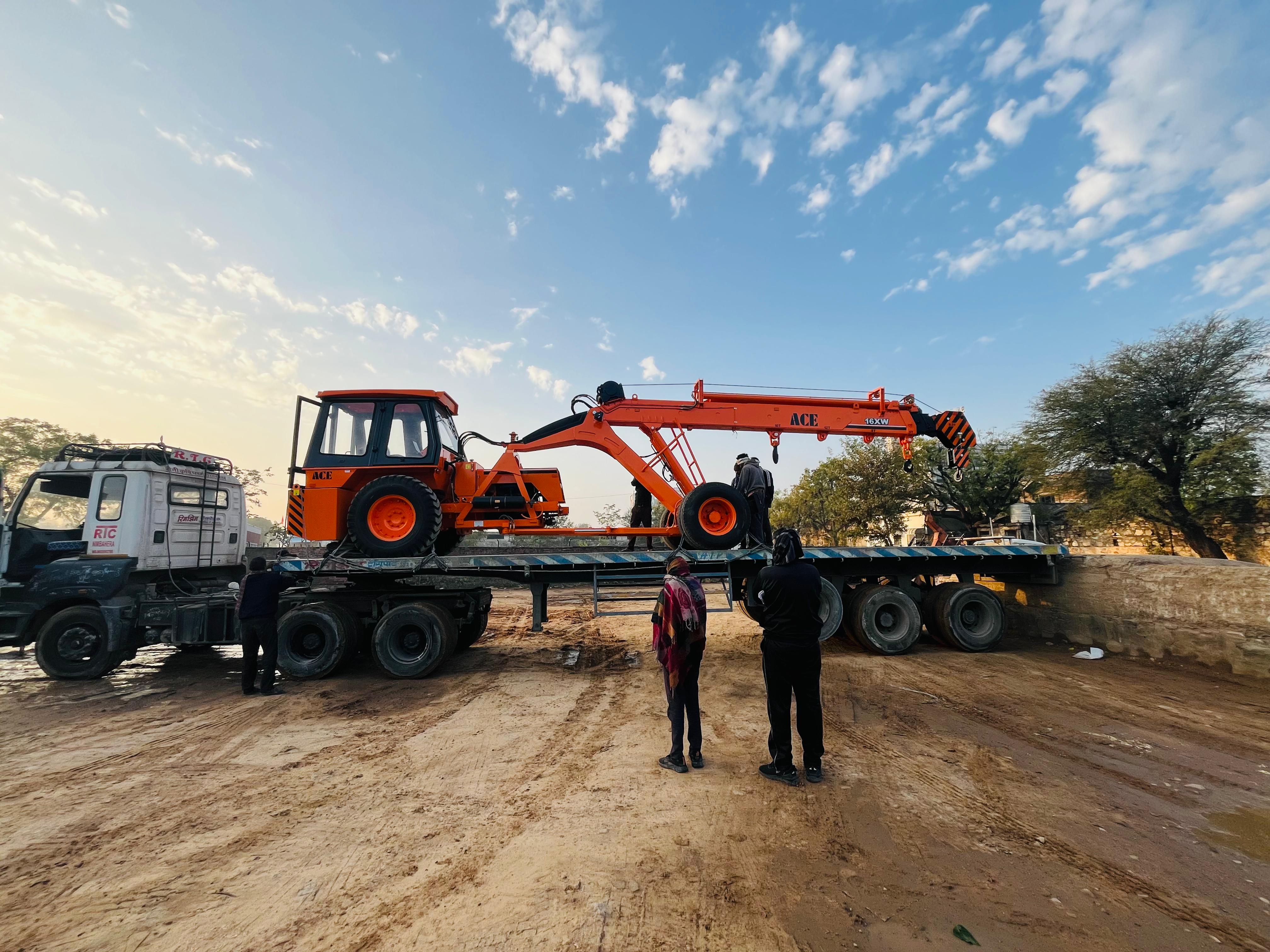 Mobile crane hoisting steel at a construction site in Jaipur